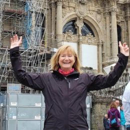 a picture of a pilgrim in front of a cathedral