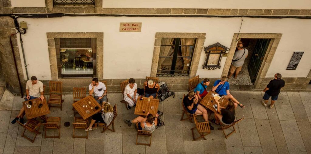 people sitting outside a cafe