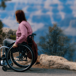 A woman using a wheelchair on a natural path Camino